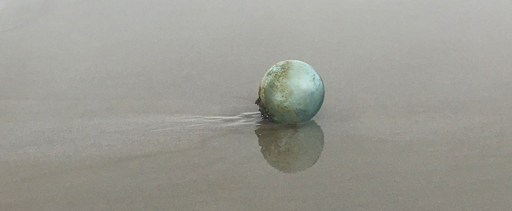 glass japanese fishing float found on the beach