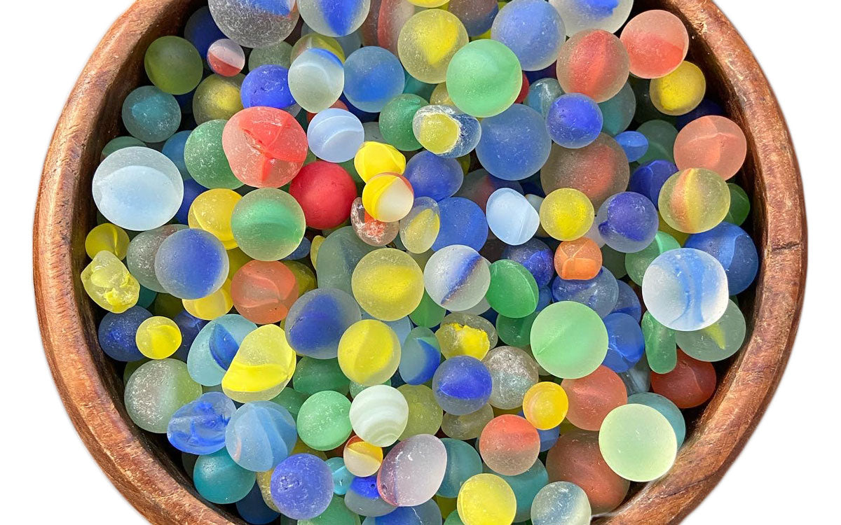 bowl filled with sea marbles from the caribbean
