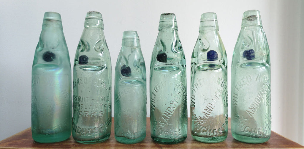 blue codd marbles in bottles