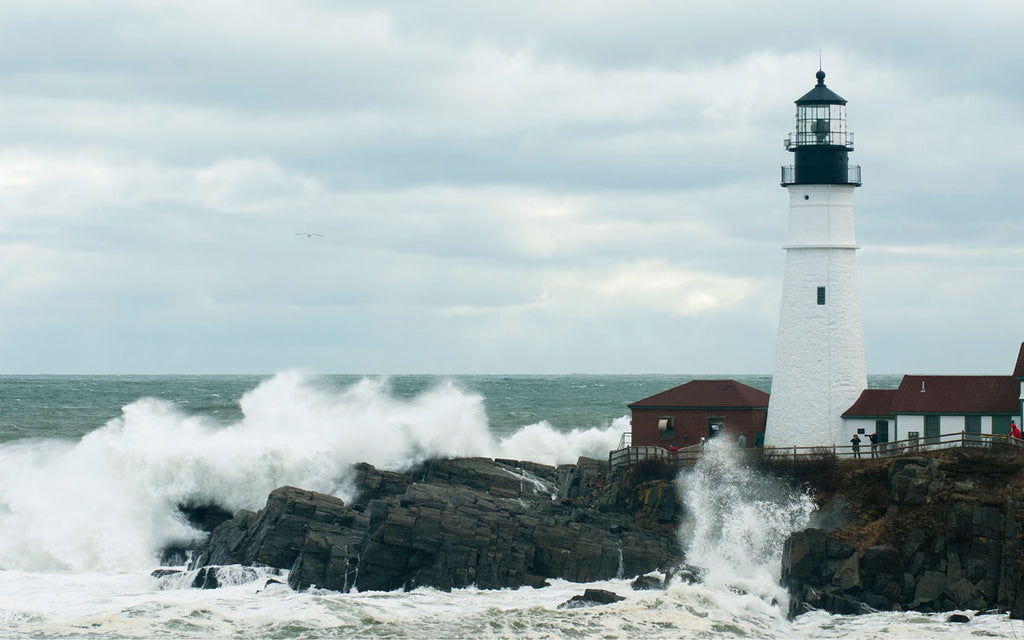 Astronomically high tides cause huge waves at the Portland Head Light in Cape Elizabeth, Maine.