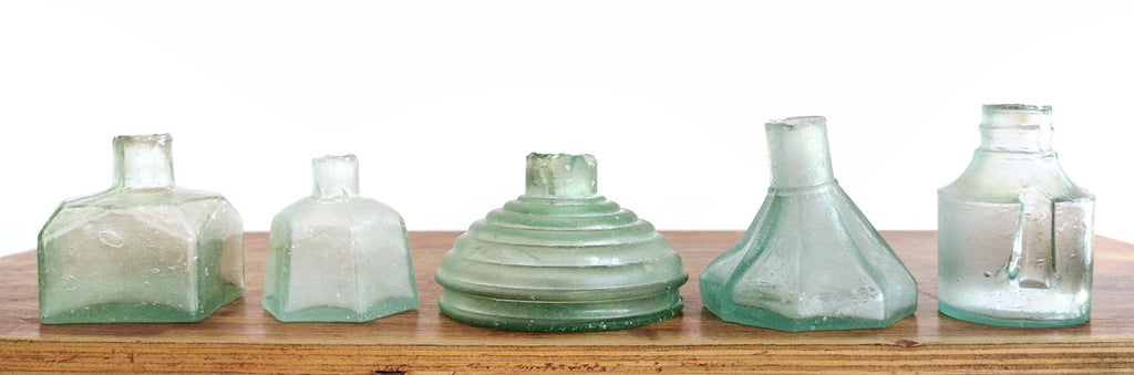 different styles of antique ink bottles