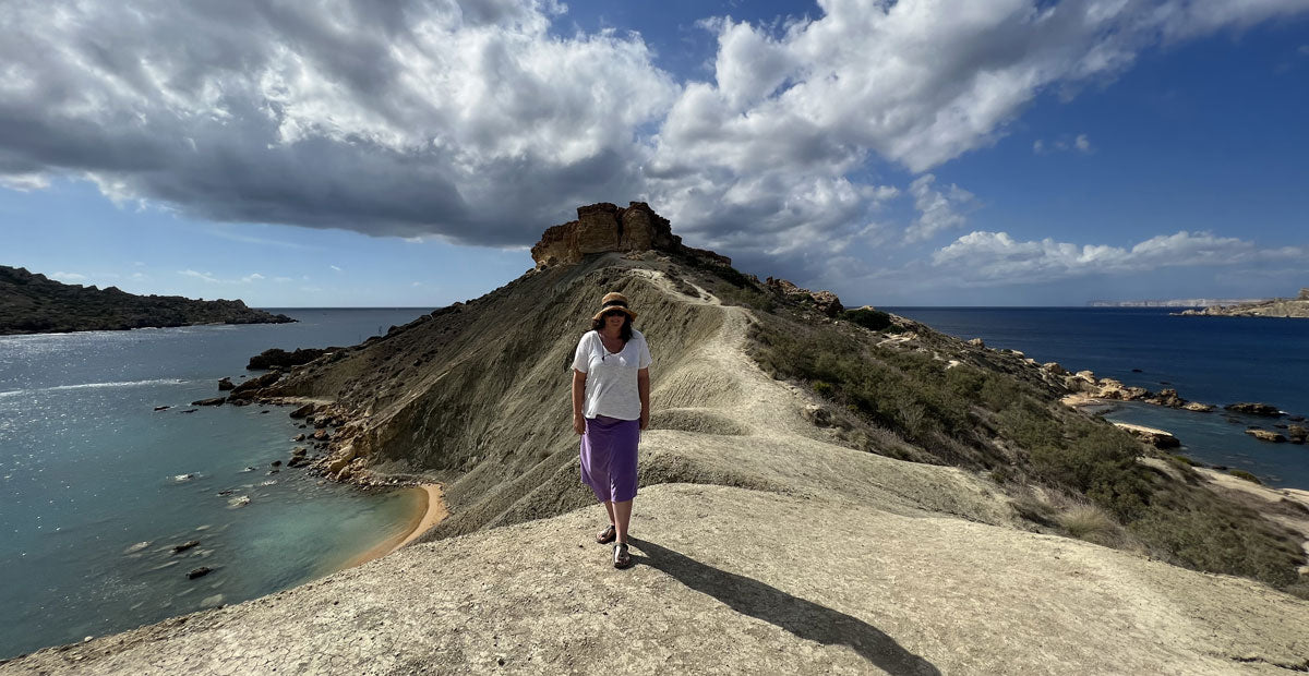beachcomber walking the coast of malta