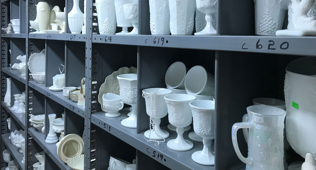 There’s no shortage of milk glass, as illustrated by these shelves of vintage milk glass for sale in a thrift shop (Edgar Lee Espe).