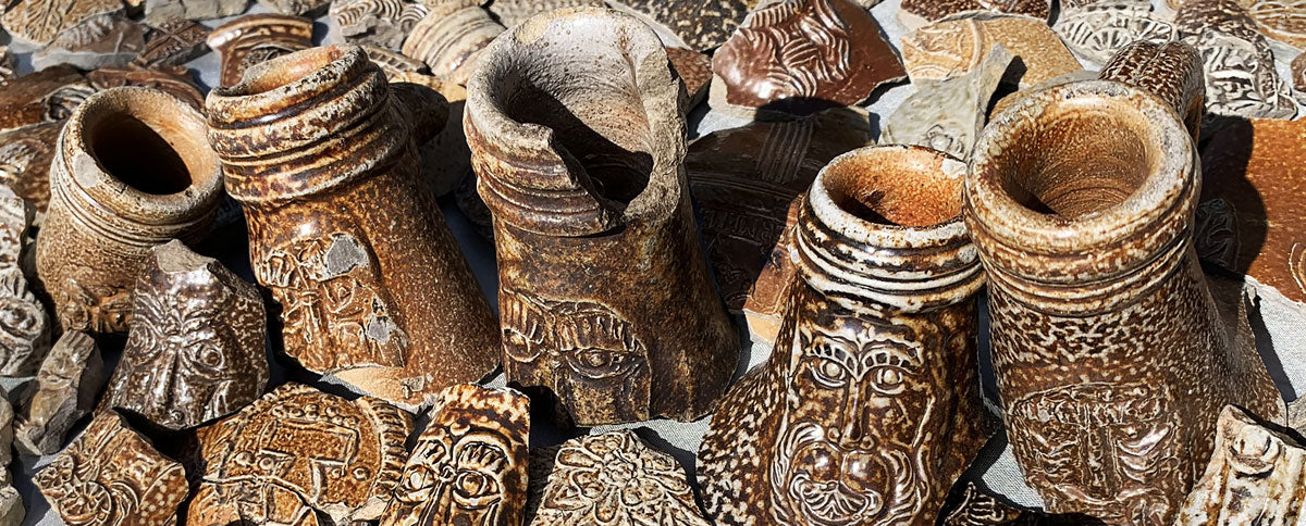 bellarmine jug faces found in london foreshore