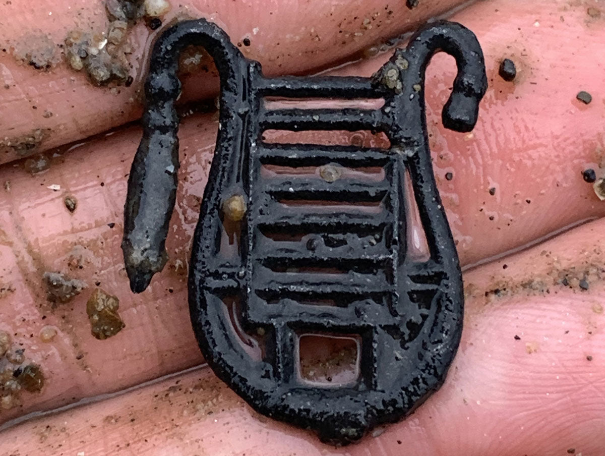 19th-century badge in the shape of a miniature bell lyre