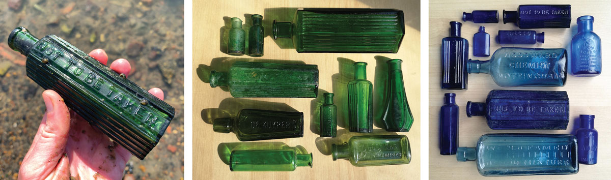 green and blue antique glass medicine and poison bottles