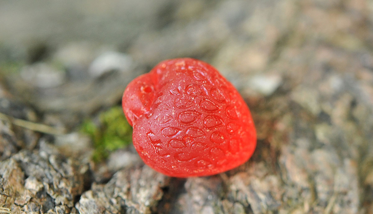 strawberry red glass bead from beach