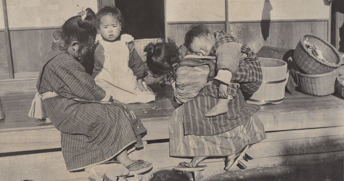 historical photo of girls playing with ohajiki in japan