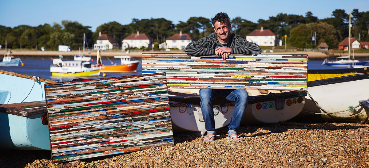 eco artist using reclaimed wood from beaches