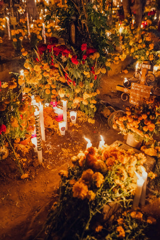 Ofrenda for the deceased with candles and flowers at Patzcuaro, Mexico