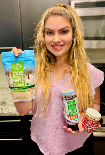 Arzu Esendemir holding up Butternut Mountain Farms products