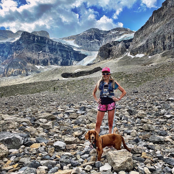 woman hiking with dog stanley glacier bc