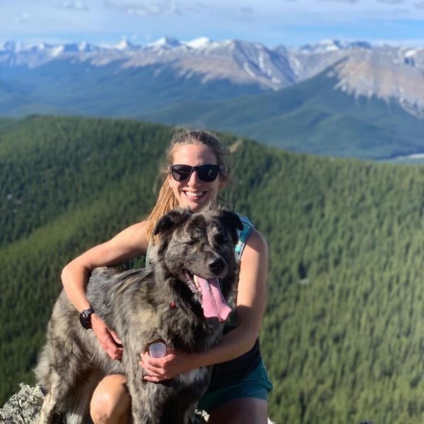 female and dog hiking in the canadian rockies