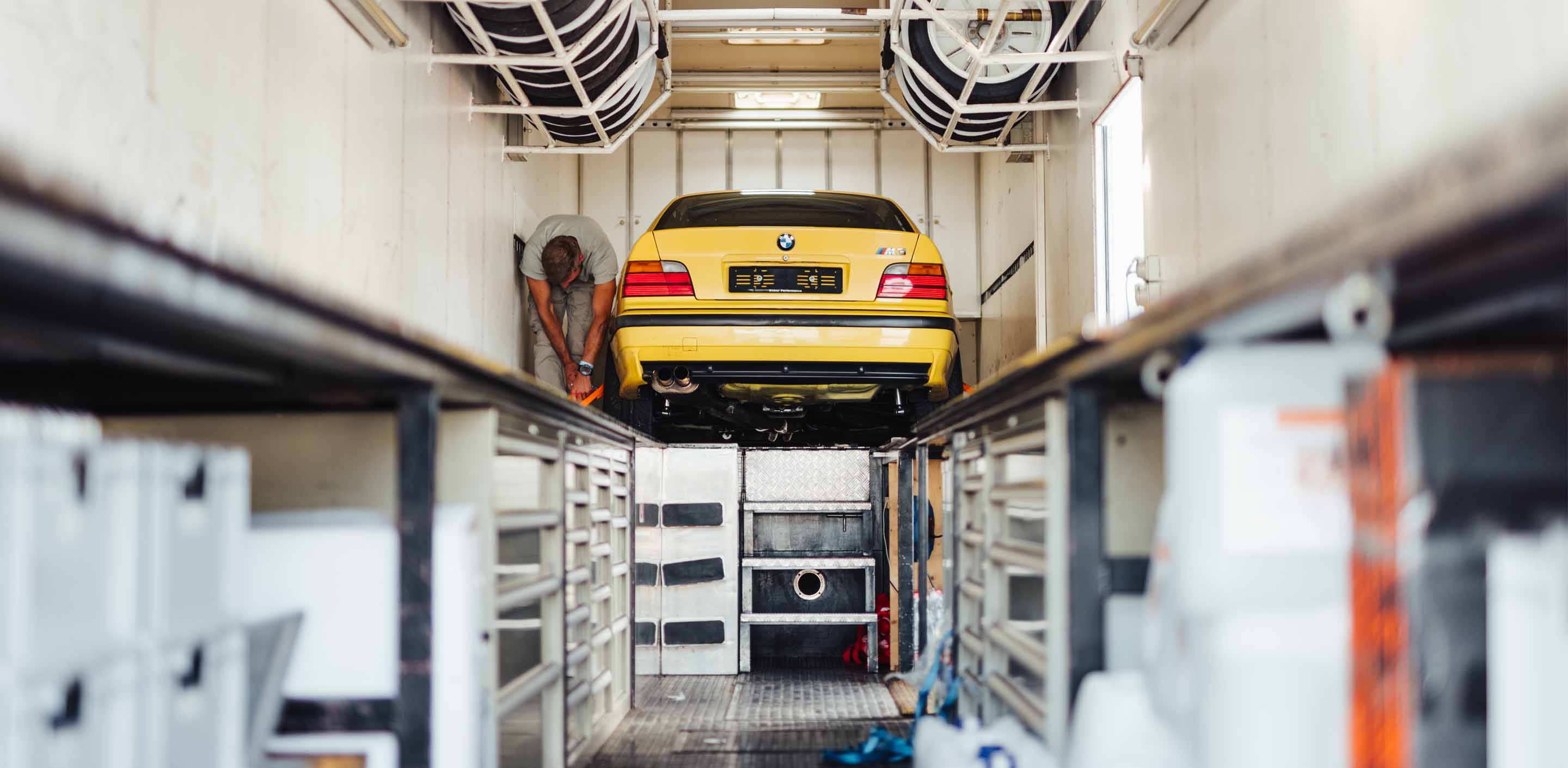 A BMW E36 M3 in a trailer during a GP Days Open Pitlane Track Day at Circuit Diijon Prenois