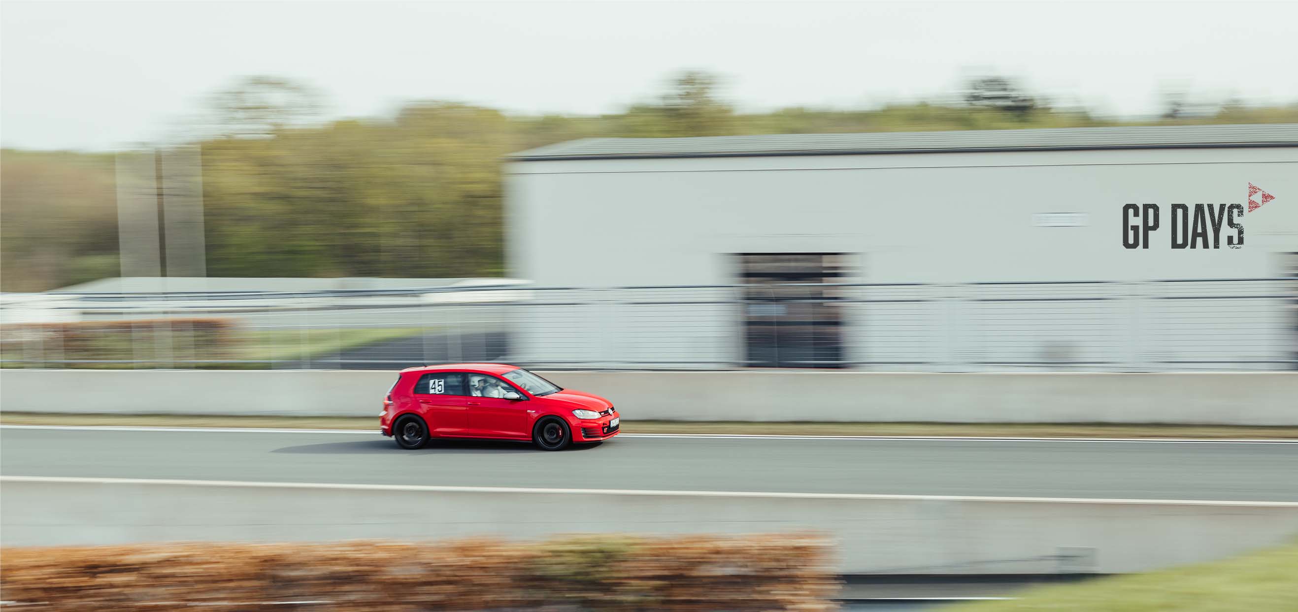 A VW Golf R Driving on the main straight of Bilster Berg Drive Resort during a GP Days Open Pitlane Track Day