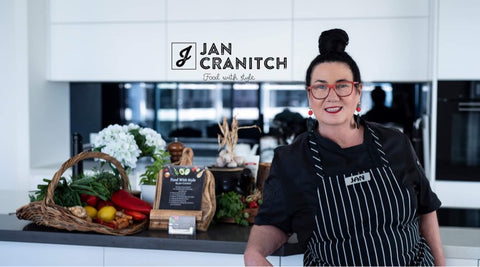 Expert Chef Jan in her kitchen with her Chef apron on