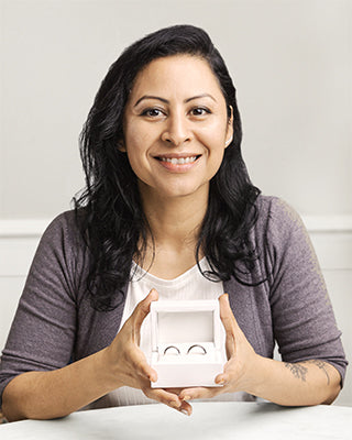 Alex from Australian Wedding Rings holding her rings