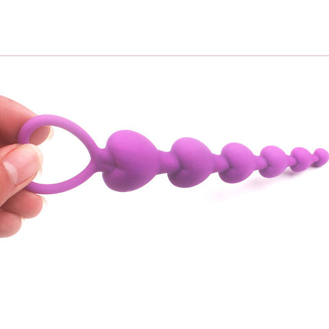 Main tenant un perle anale silicone violet-Le Royaume Du Plug