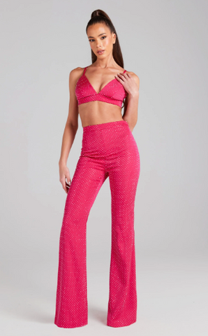 woman stood wearing Kira hot pink pants with matching Kira hot pink bra top