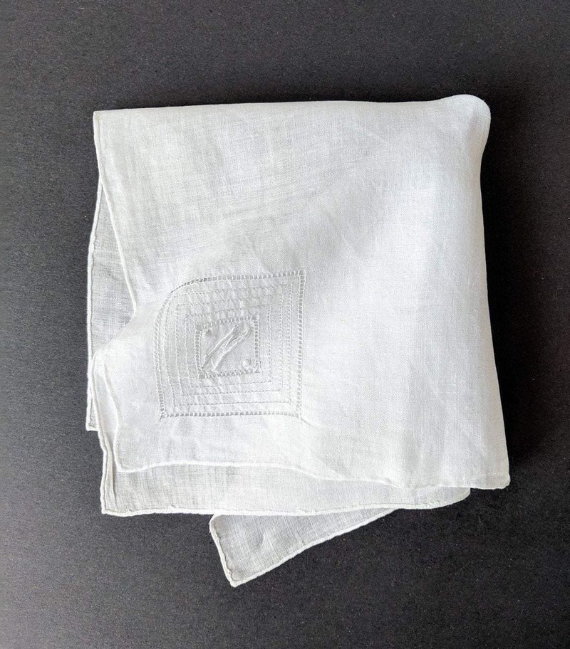 Vintage monogramed handkerchief made out of cotton blend, with embroidered letter M in one corner.