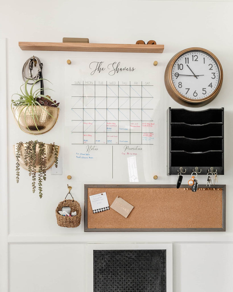 Blesser House command center with pegboard, key holder, clock and acrylic calendar