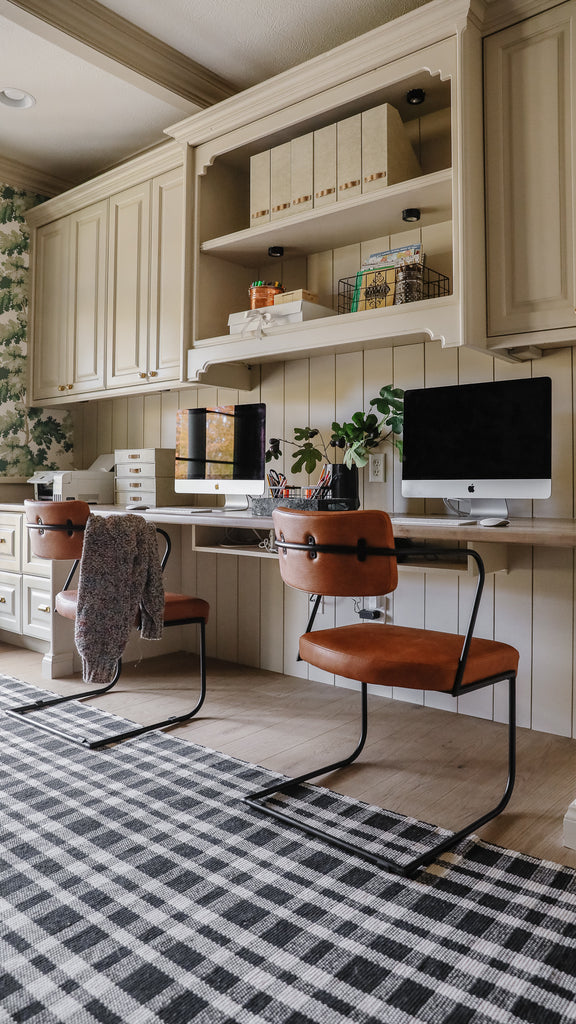 Home office workstation with 2 brown leather chairs and workstations