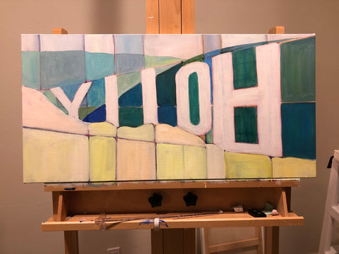 Hollywood sign from behind painting