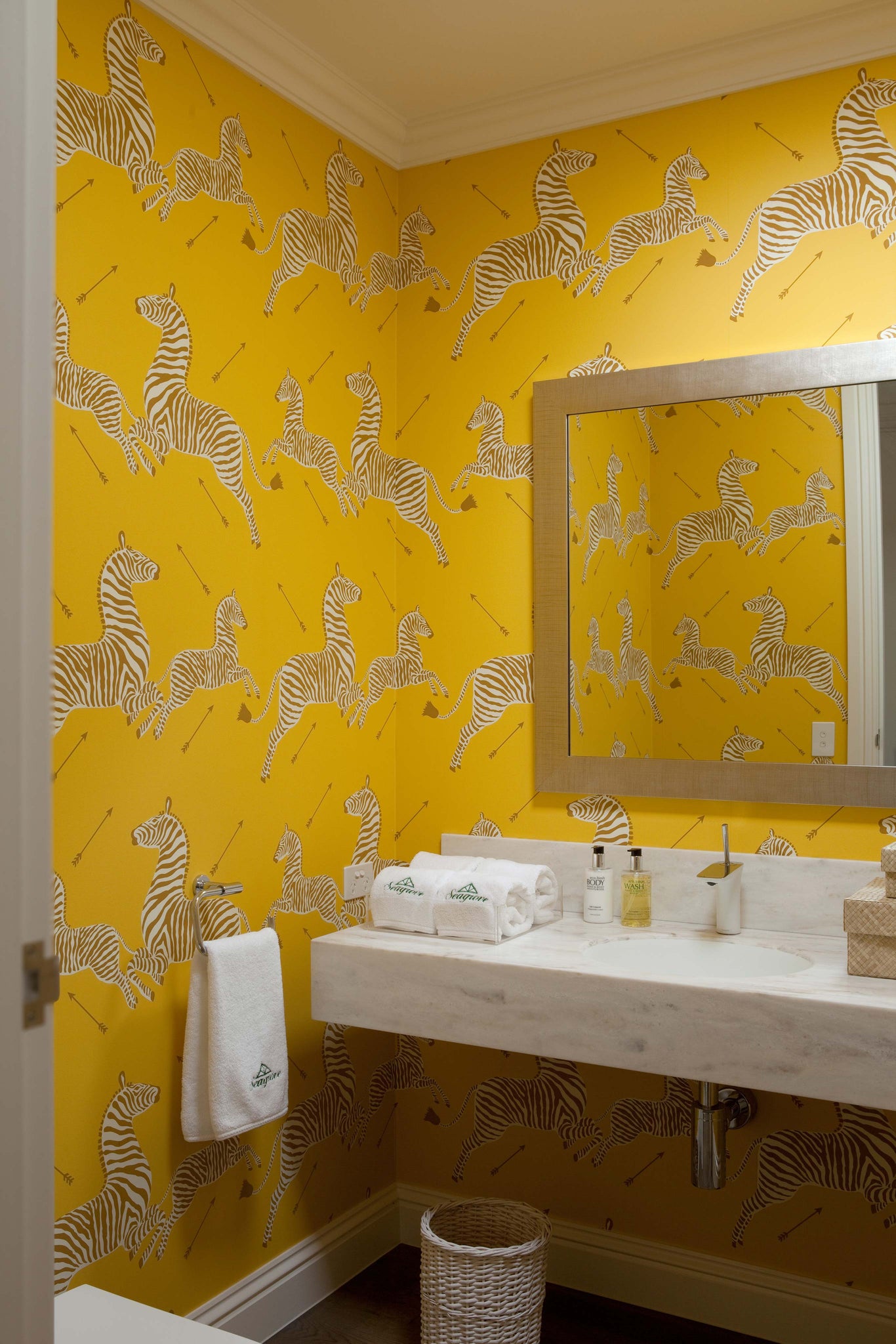 Yellow wallpapered bathroom