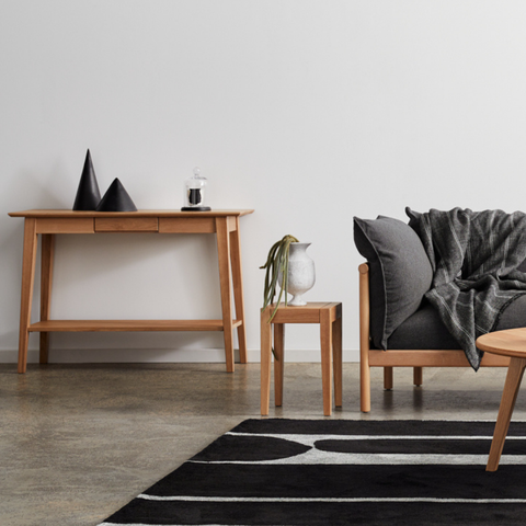 oak console table and sofa