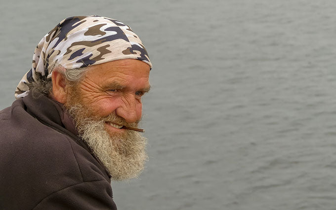 an elderly man smoking