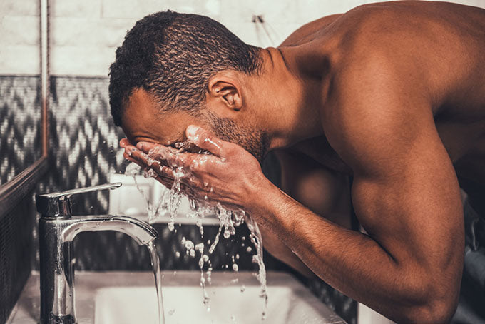 washing face over sink