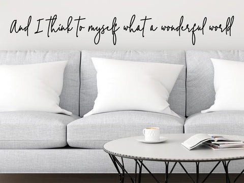 Living room wall decals that say ‘And I think to myself what a wonderful world’ on a living room wall.