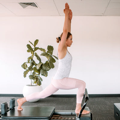 A Woman Practicing Pilates to Stay Healthy