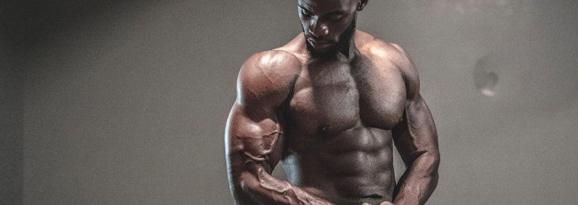 A Man Showing Off His Biceps After a Workout