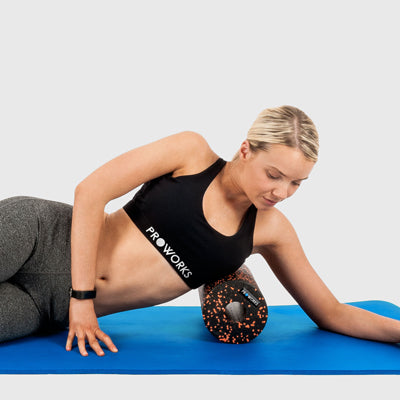 Girl Exercising with a Proworks Foam Roller