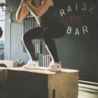 Girl Squatting in her Home Gym