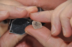 examining a rough diamond