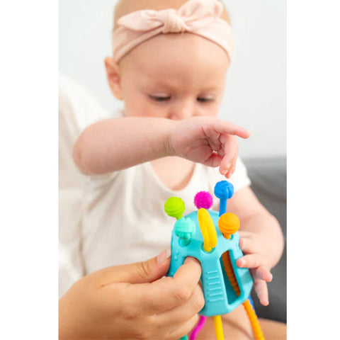 Baby playing with Zippee toy by Mobi