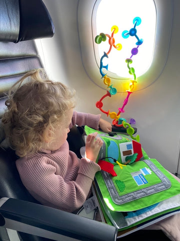 airplane tray cover   kids and babies busy on an airplane - a