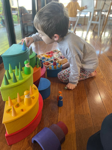 Child colour matching loose parts.