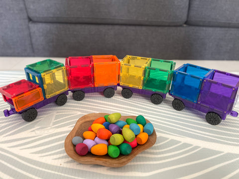 Colour sorting with loose parts and a train.