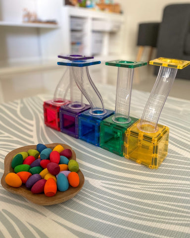 Colour-matching activity with rainbow eggs and the Connetix ball run.