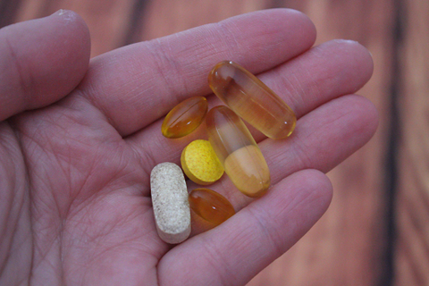 Person holding Variety of Multivitamins