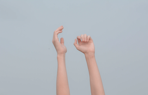 A person with their hands in the air