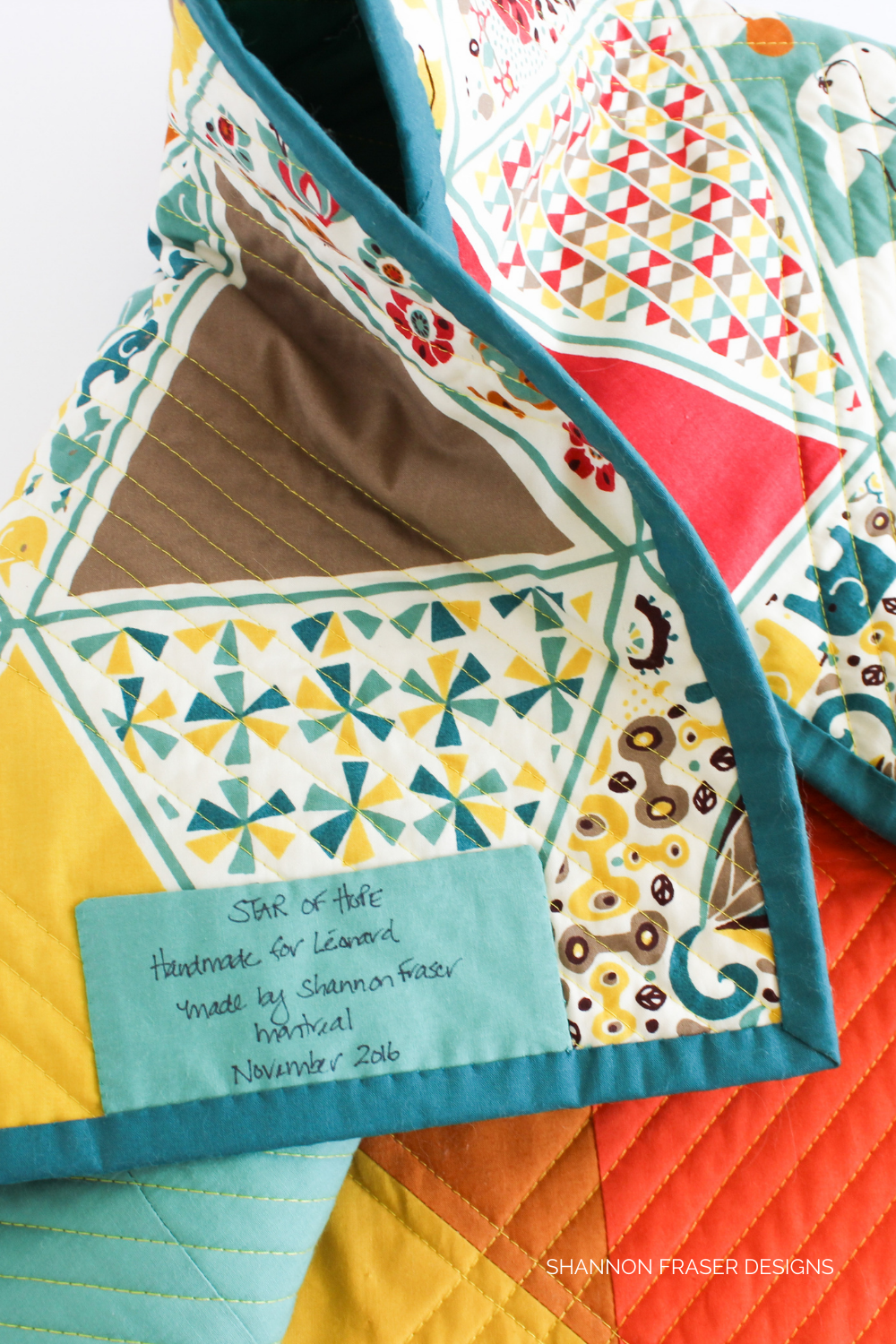 Custom handmade quilt label for a bespoke baby quilt | DIY Quilt Label Tutorial | Shannon Fraser Designs #modernbabyquilt #quiltlabel