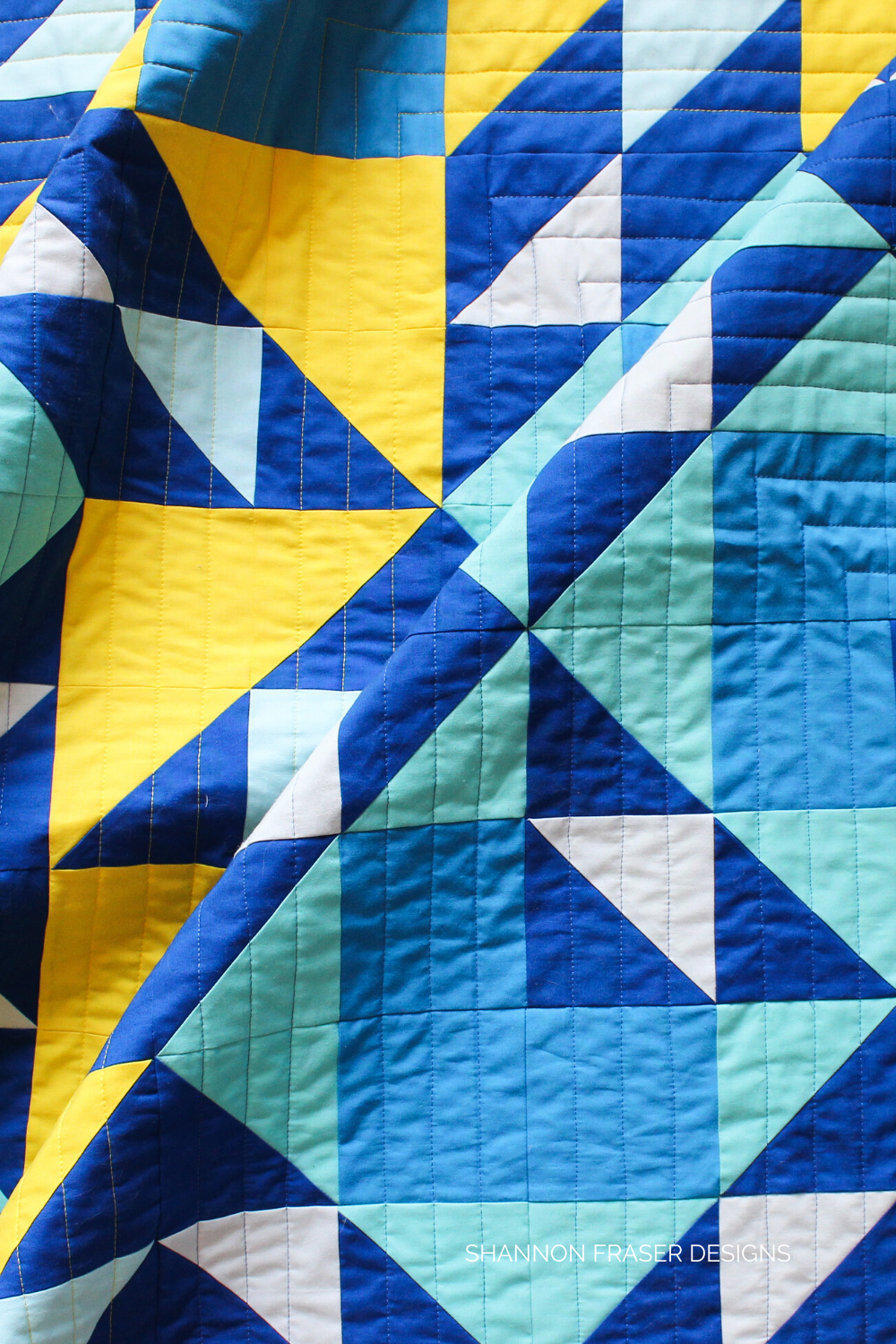 Blue ombre and yellow half square triangles featured in the Double Windmill Quilt | Shattered Star QAL Week 3: How to make HSTs | Shannon Fraser Designs #quilt