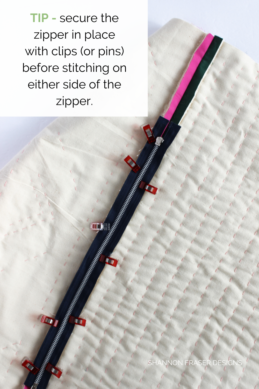 Metal zipper clipped into place in the basted seam allowance ready to be stitched in place | Sewing Tutorial | Shannon Fraser Designs #zipper #howto
