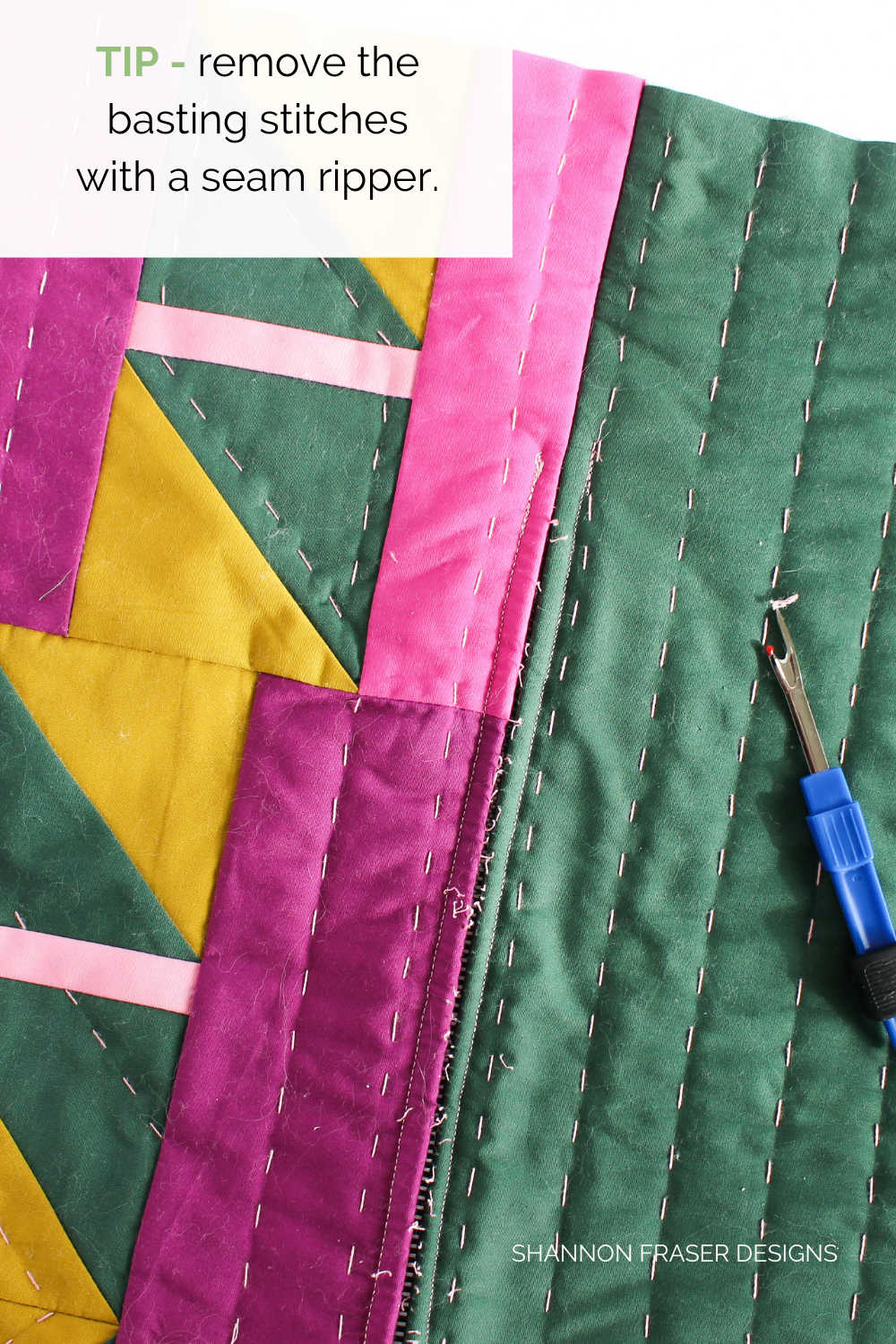 Use a seam ripper to gently remove your basted stitches from the bottom of your Shattered Star lumbar pillow | Sewing tutorial: how to install a metal zipper | Shannon Fraser Designs #quiltedpillow