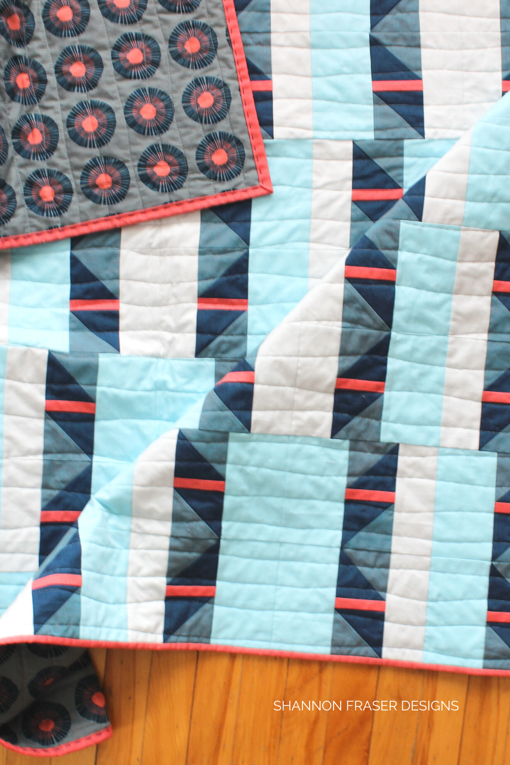 Shattered Star quilt the blue and coral Artisan Cotton version with the gorgeous Seaside Daisy print from Jen Hewett's Imagined Landscapes collection | Modern Quilt Pattern | Shannon Fraser Designs #halfsquaretriangles