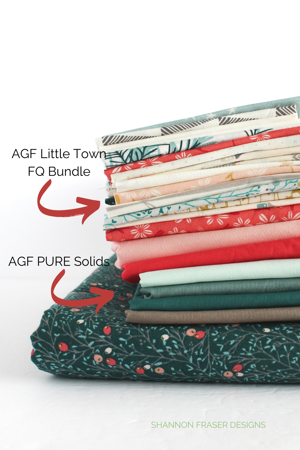 Stack of Little Town fat quarter bundle with some AGF Pure Solids from Art Gallery Fabrics for the Shattered Star Quilt Along Holiday Quilt | Shannon Fraser Designs #fabricbundle